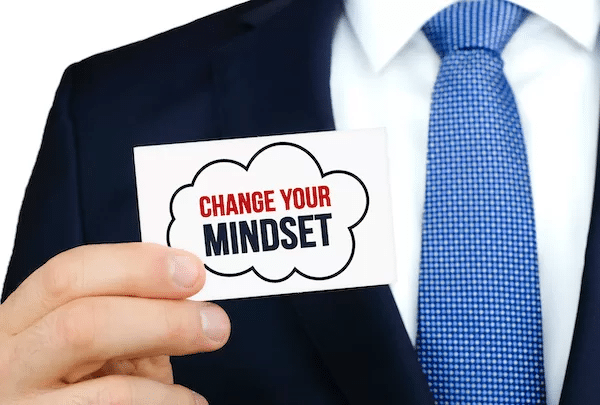 Growth mindset image man holding card with wording 